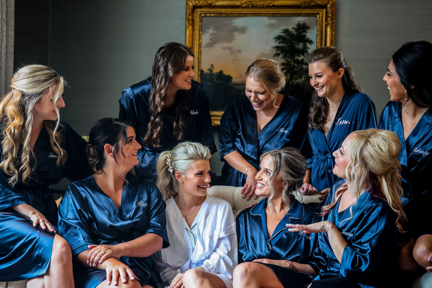 Bride and bridesmaids relaxing in a bedroom in Adare Manor the morning of a wedding