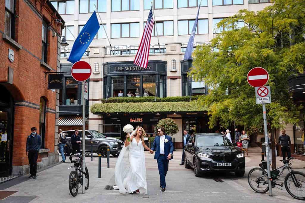Bride and Groom outside The Westbury Hotel