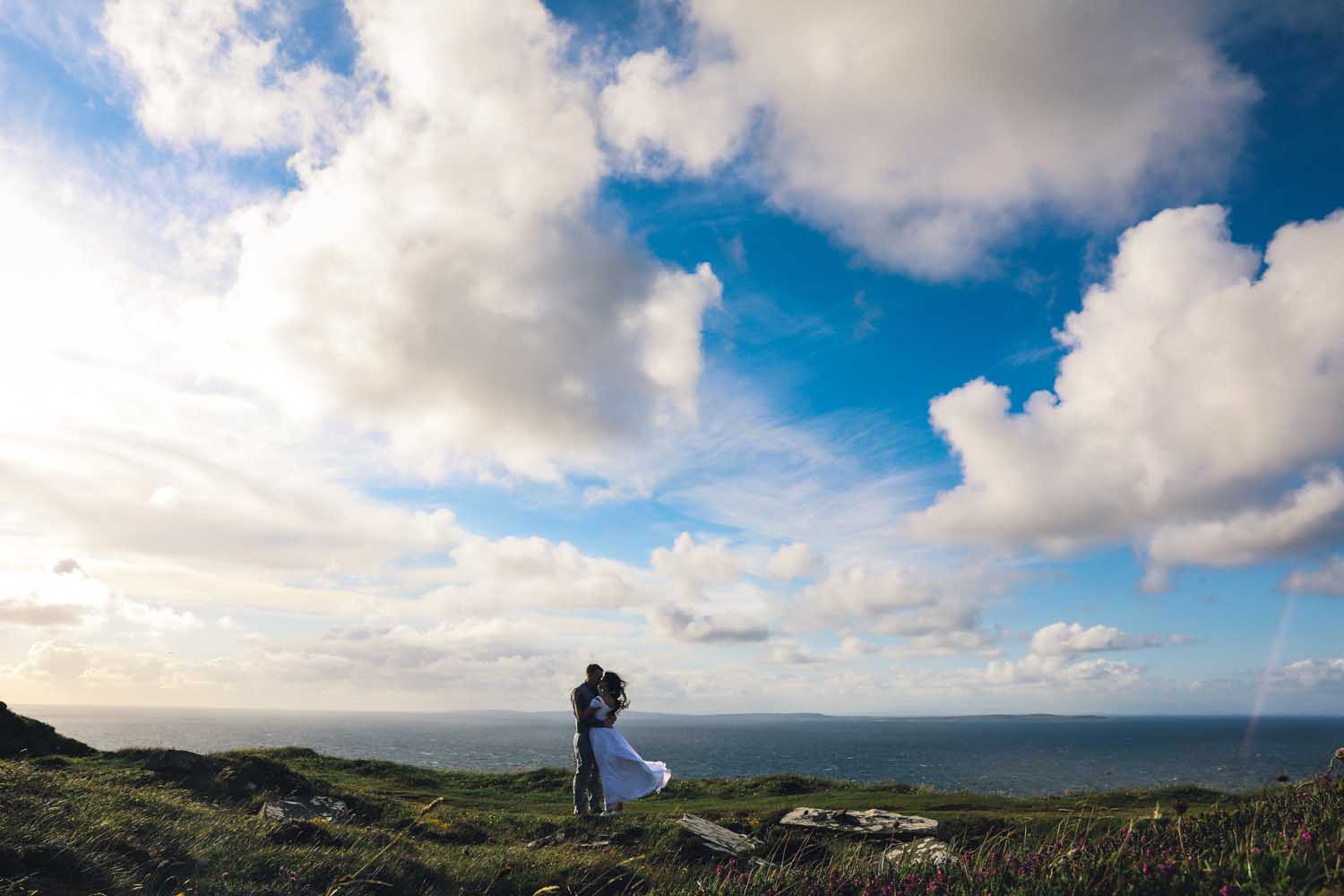Couple kissing against a spectacular view of the Atlantic Ocean