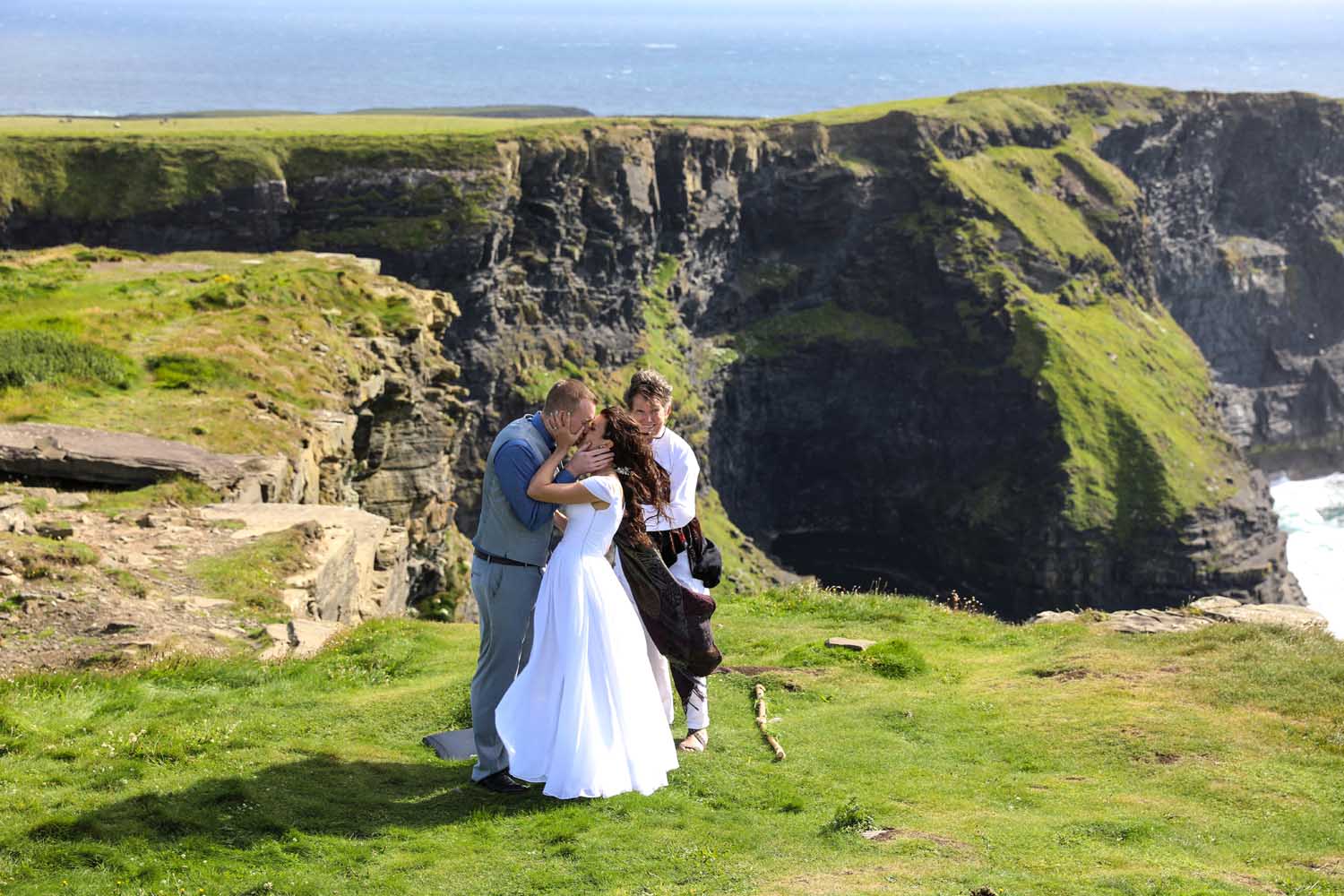 Sealing the deal on their wedding day at the Cliffs of Moher