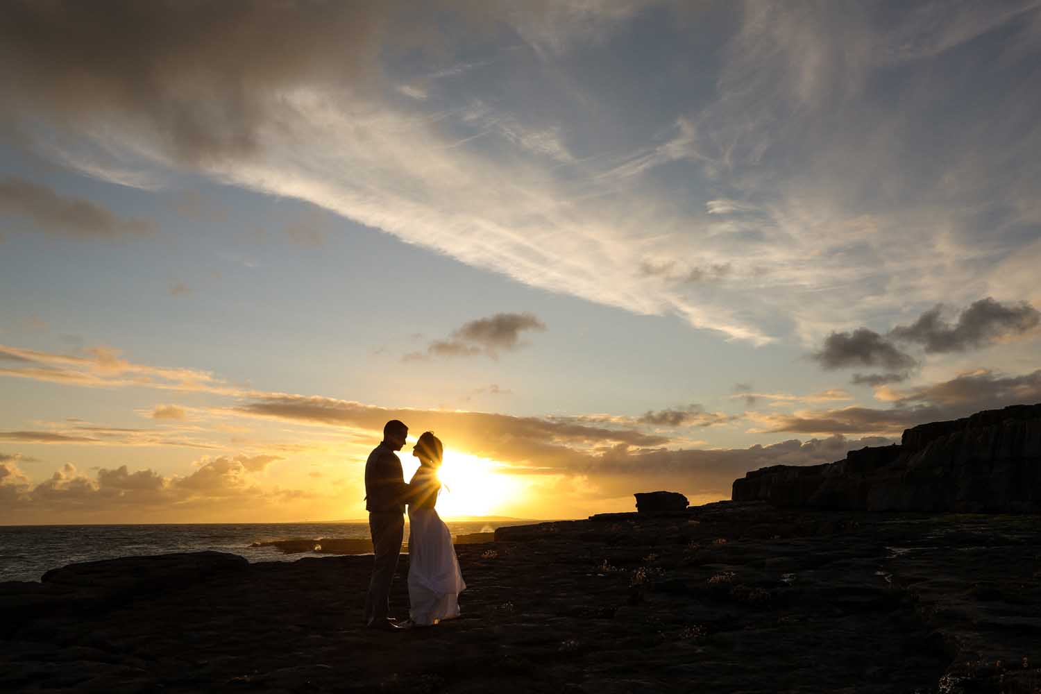 Close up of married couple at sunset on the irish coast