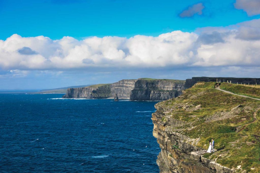 Couple alone on a cliff in Co. Clare, Ireland