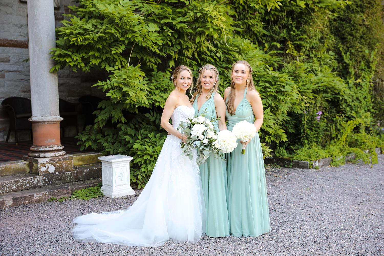 Bride with her bridesmaids on her wedding day