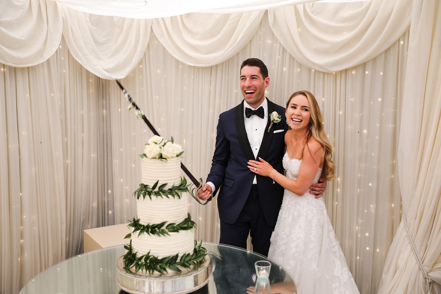 Couple cutting their wedding cake