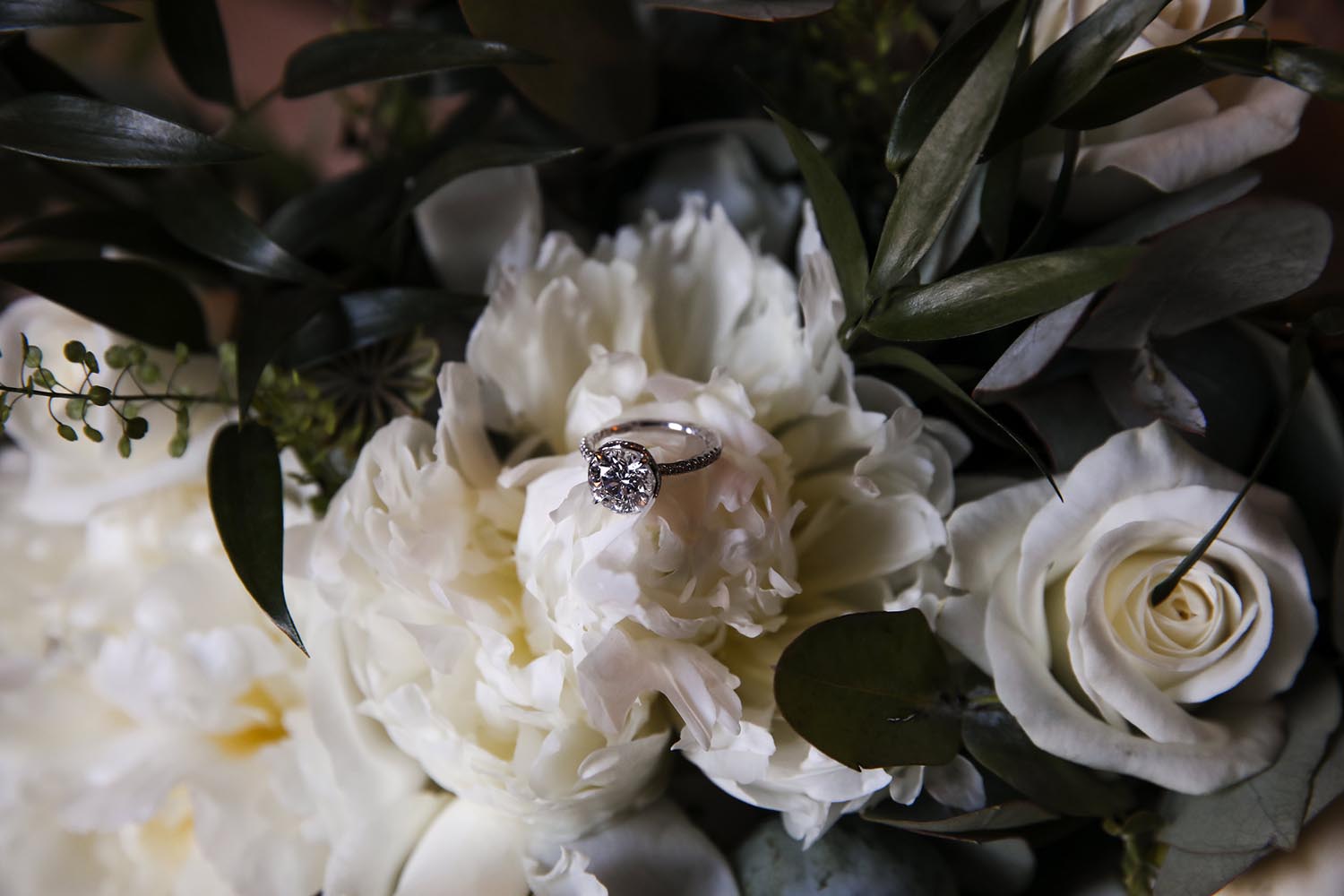 Engagement ring set against flowers