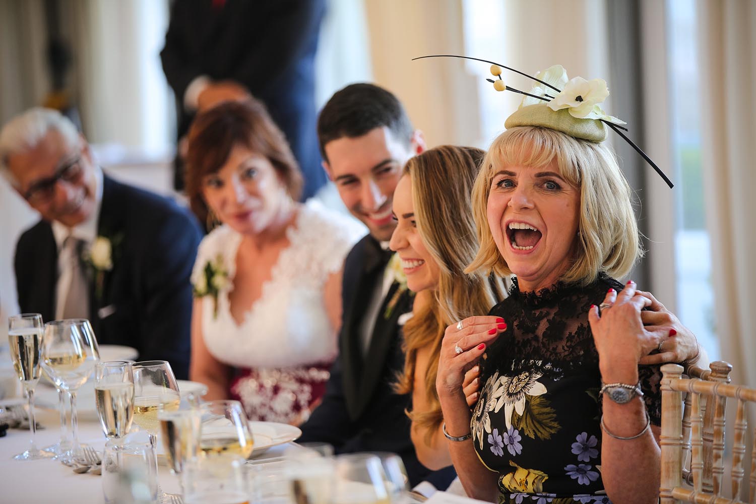 Wedding guest laughing during speeches