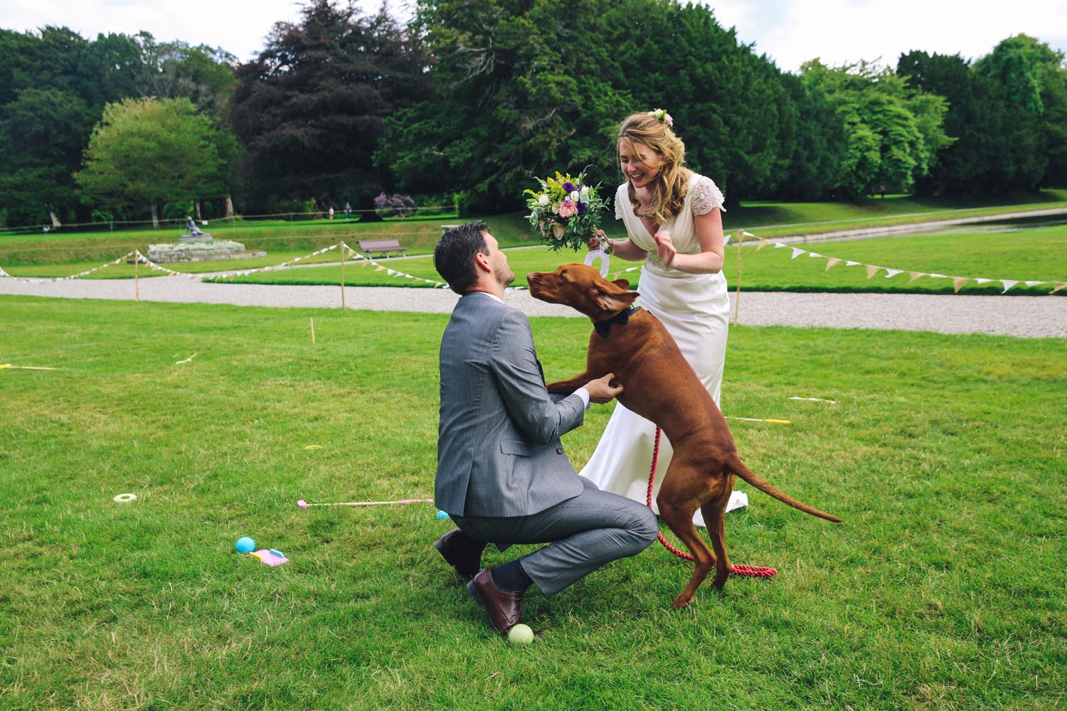 Married couple having fun with their dog