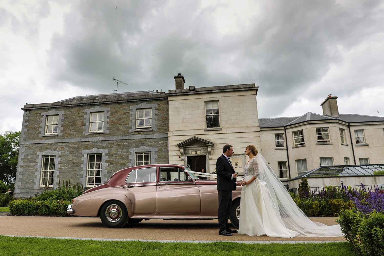 Bride and Groom and wedding car