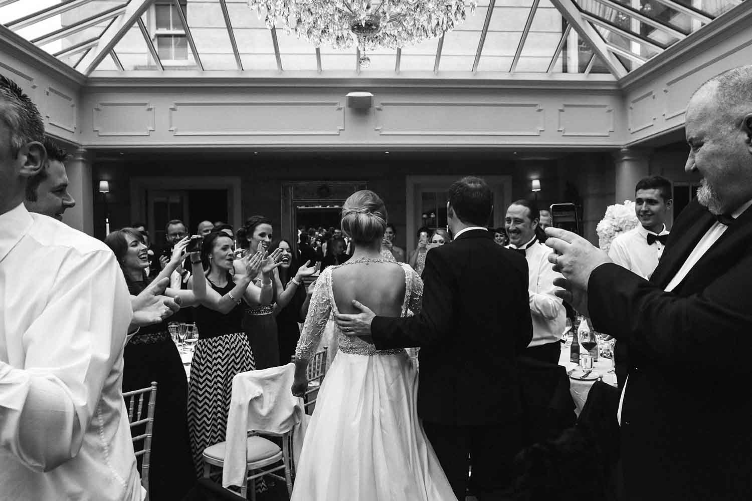 Couple enter the room for their wedding celebration at Tankardstown House