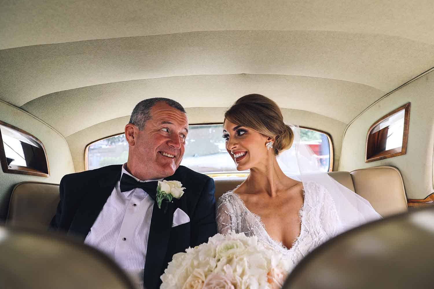 Close up of Father and Daughter in the car on her wedding day