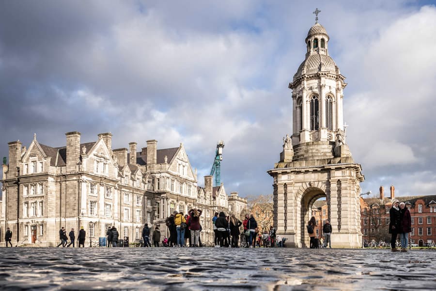 Tourists exploring Trinity College Dublin front square