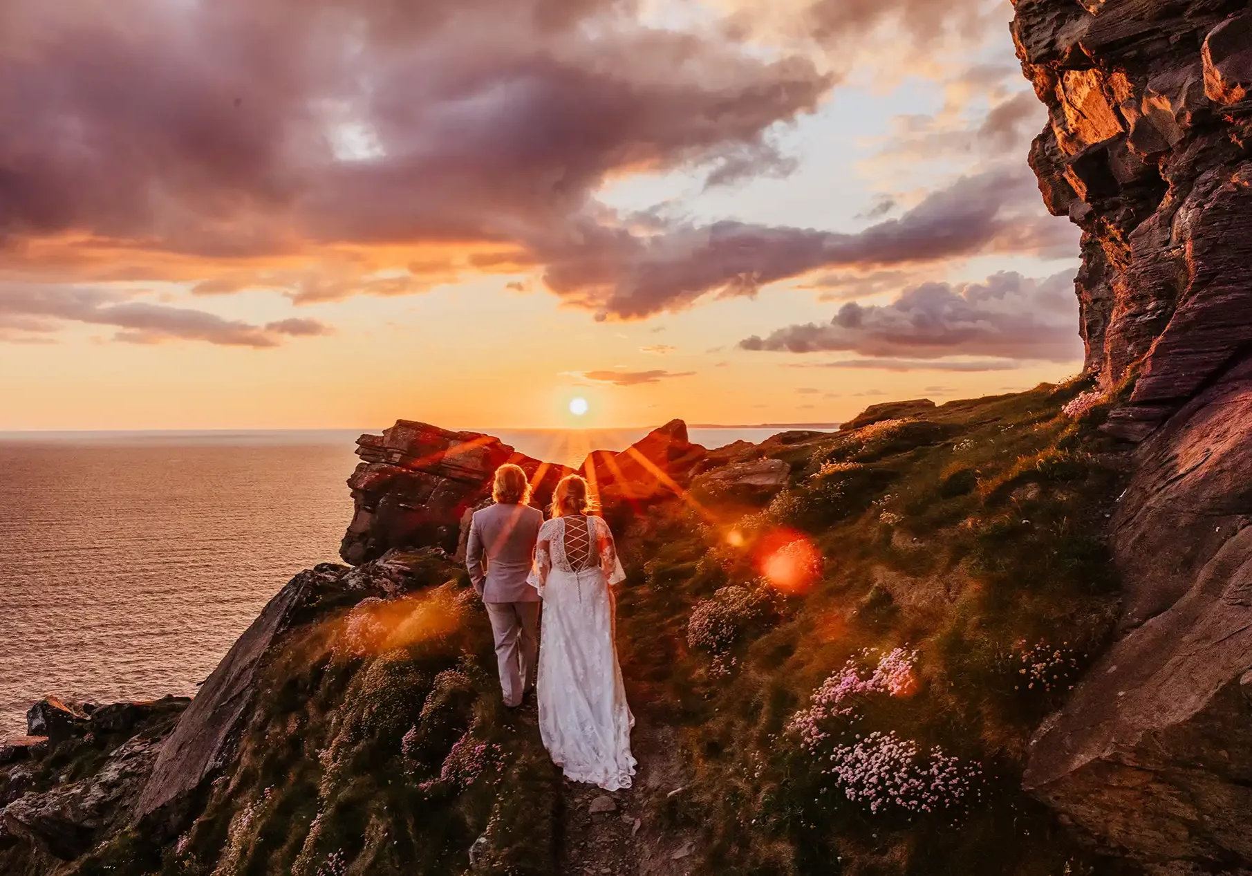Cliffs of Moher sunset couple hand-in-hand